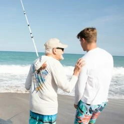 Ron Jon Sailfish Long Sleeve Hooded Sun Shirt -OOfos Sale d800x800 10480484001 white ron jon sailfish upf long sleeve hooded shirt lifestyle 2